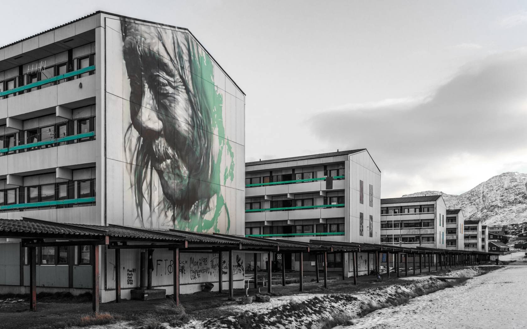 A mural of an old shaman on council housing in Nuuk, Greenland.