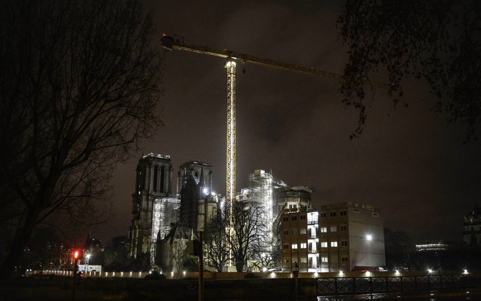 Restoration works of Notre Dame cathedral continue at night.