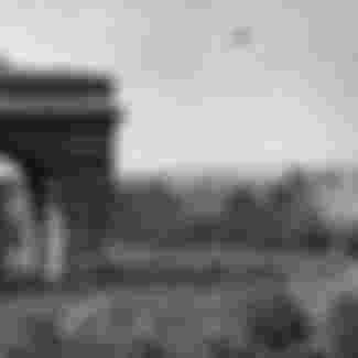 Parisians gather around the Arc de Triomphe as Allied forces liberate the city. Credit: RBM Vintage Images / Alamy Stock Photo.