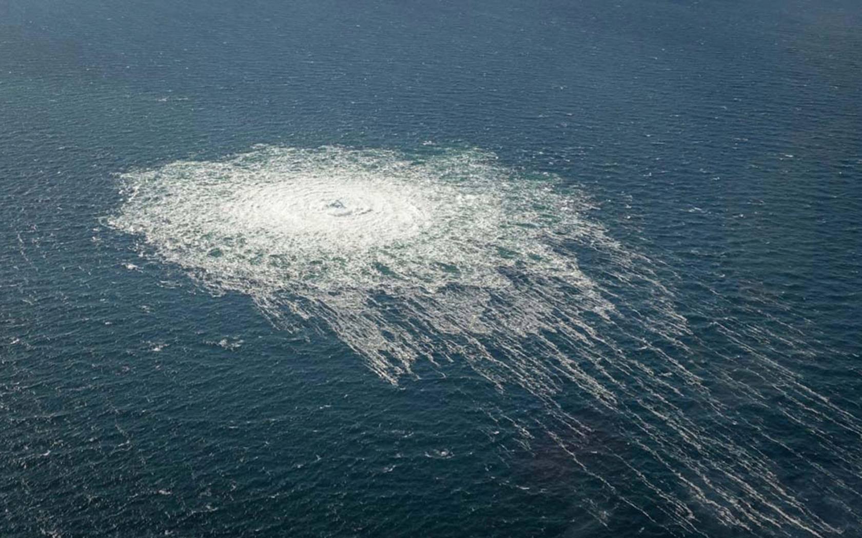 Gas from the ruptured Nord Stream 2 pipeline bubbles to the surface of the Baltic, seen from a Danish F-16 on 27 September 2022.
