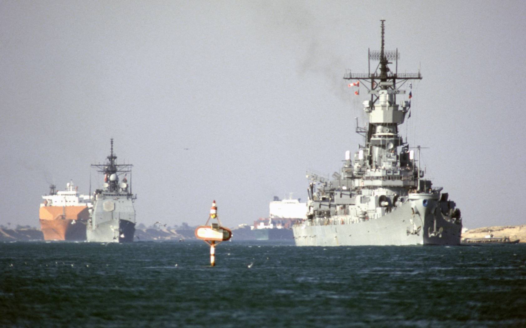 The US Navy battleship USS Iowa and USS Ticonderoga transits the Suez Canal in 1988.