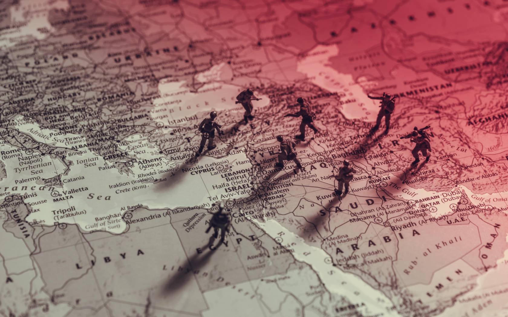 Toy soldiers on a map of the Middle East.