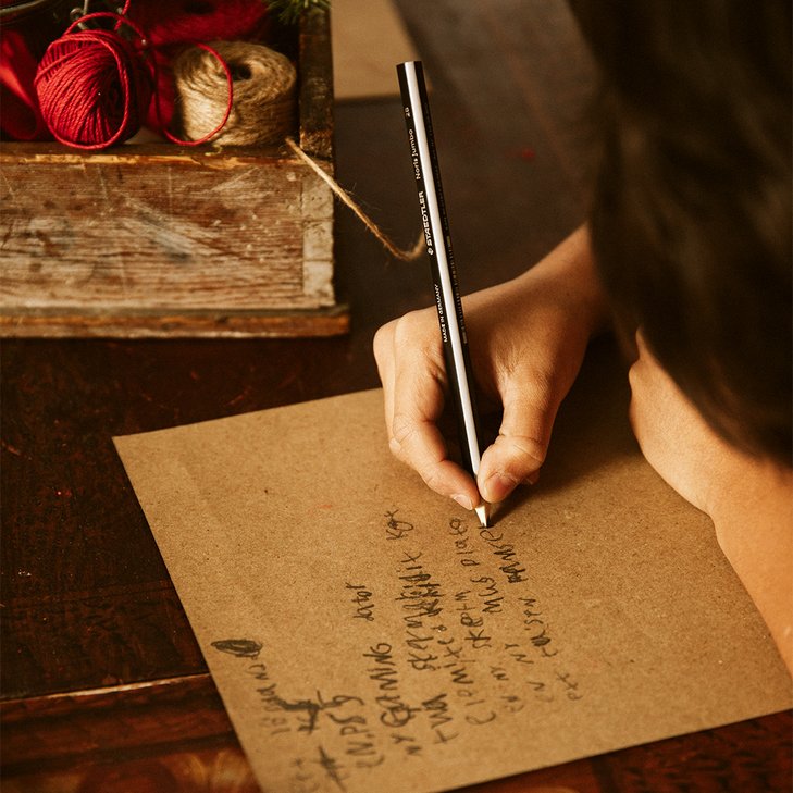 A child writes a wish list to Santa Claus