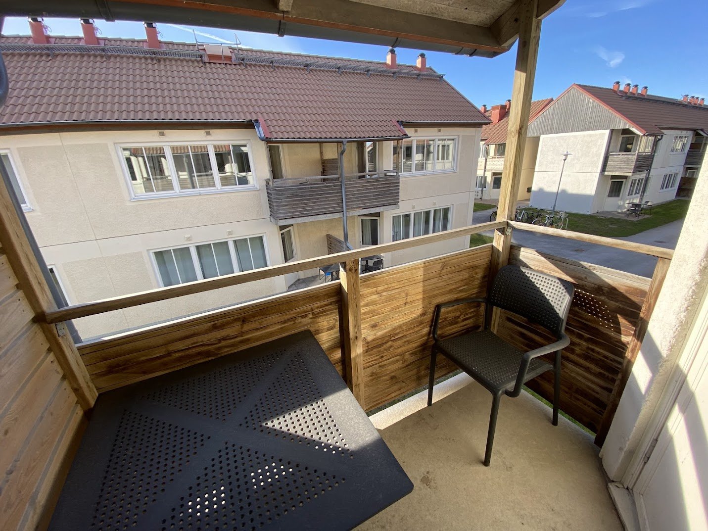 Balcony with table and chair.
