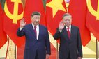 Chinese President Xi Jinping and Vietnamese President To Lam wave in Hanoi on April 14, 2025.