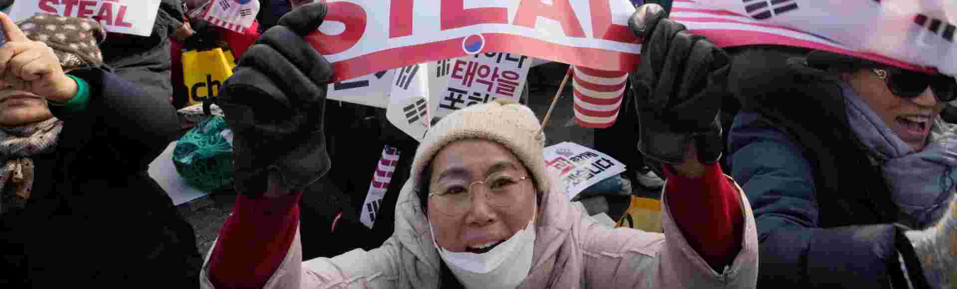 Supporters of impeached South Korean President Yoon Suk-yeol shout slogans during a rally to oppose his impeachment near the presidential residence in Seoul.