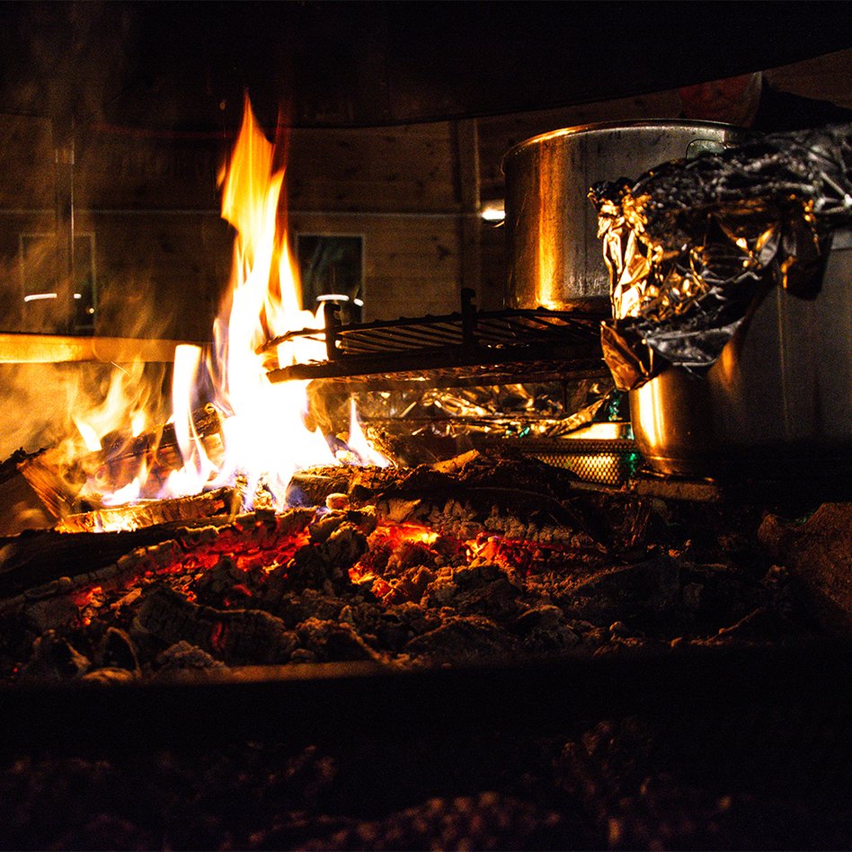 pots over an open fire in the Rakka hut