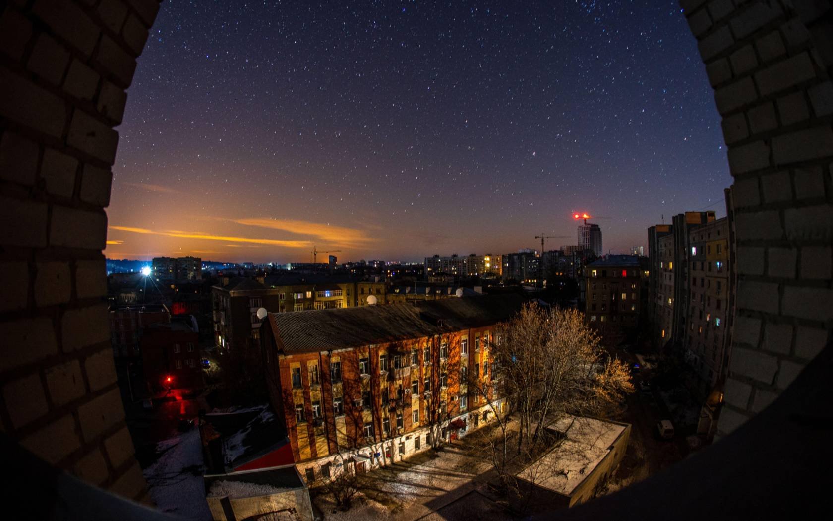 Glow from a Russian rocket attack on Kharkiv