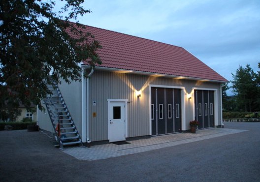 Night lit workshop and garage with pedestrian entry