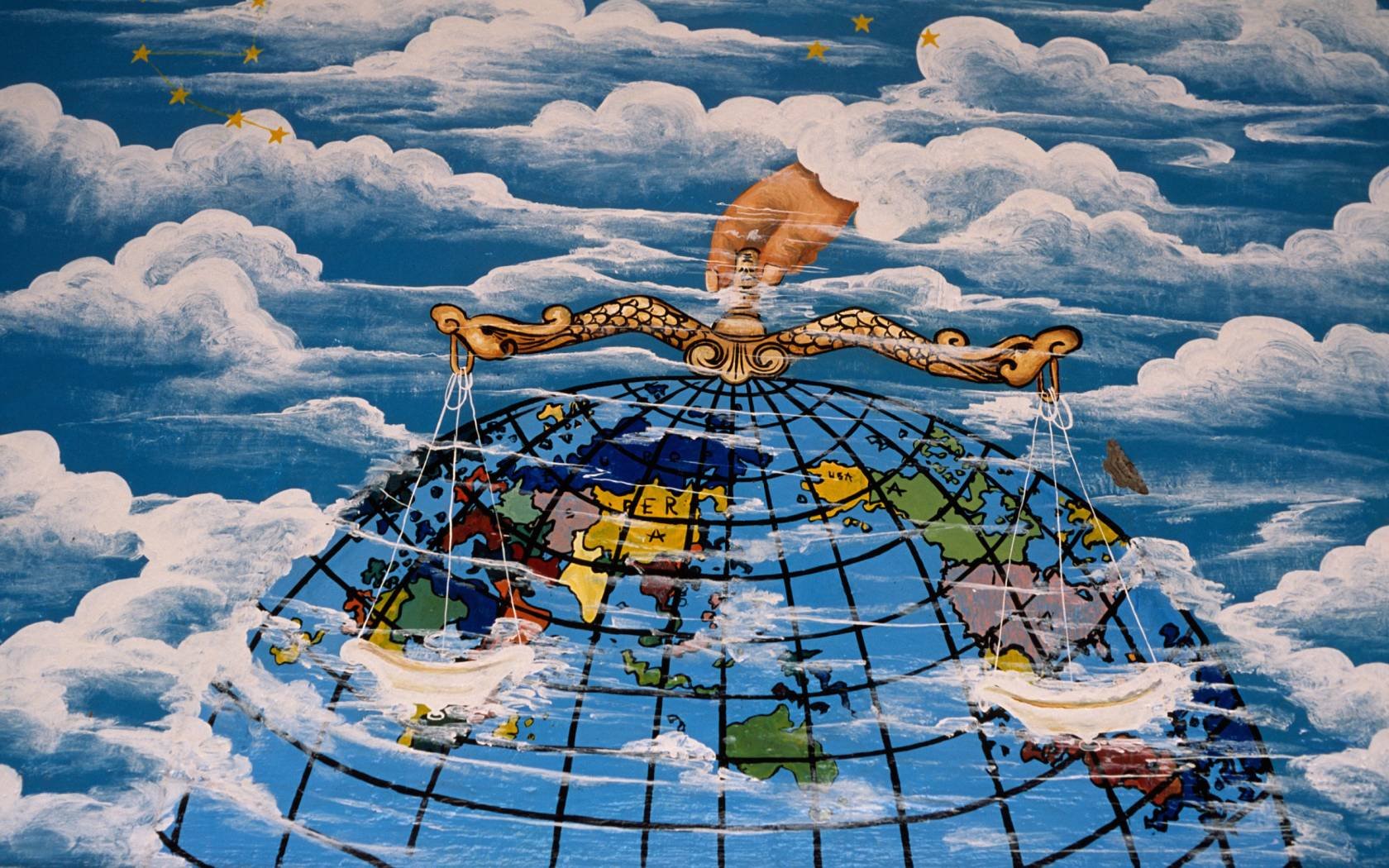 A painting on the wall of a globe.