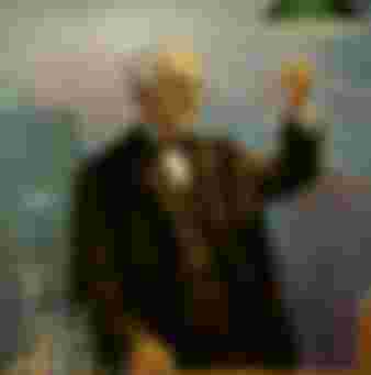 The great American inventor Thomas Edison is surrounded by his creations