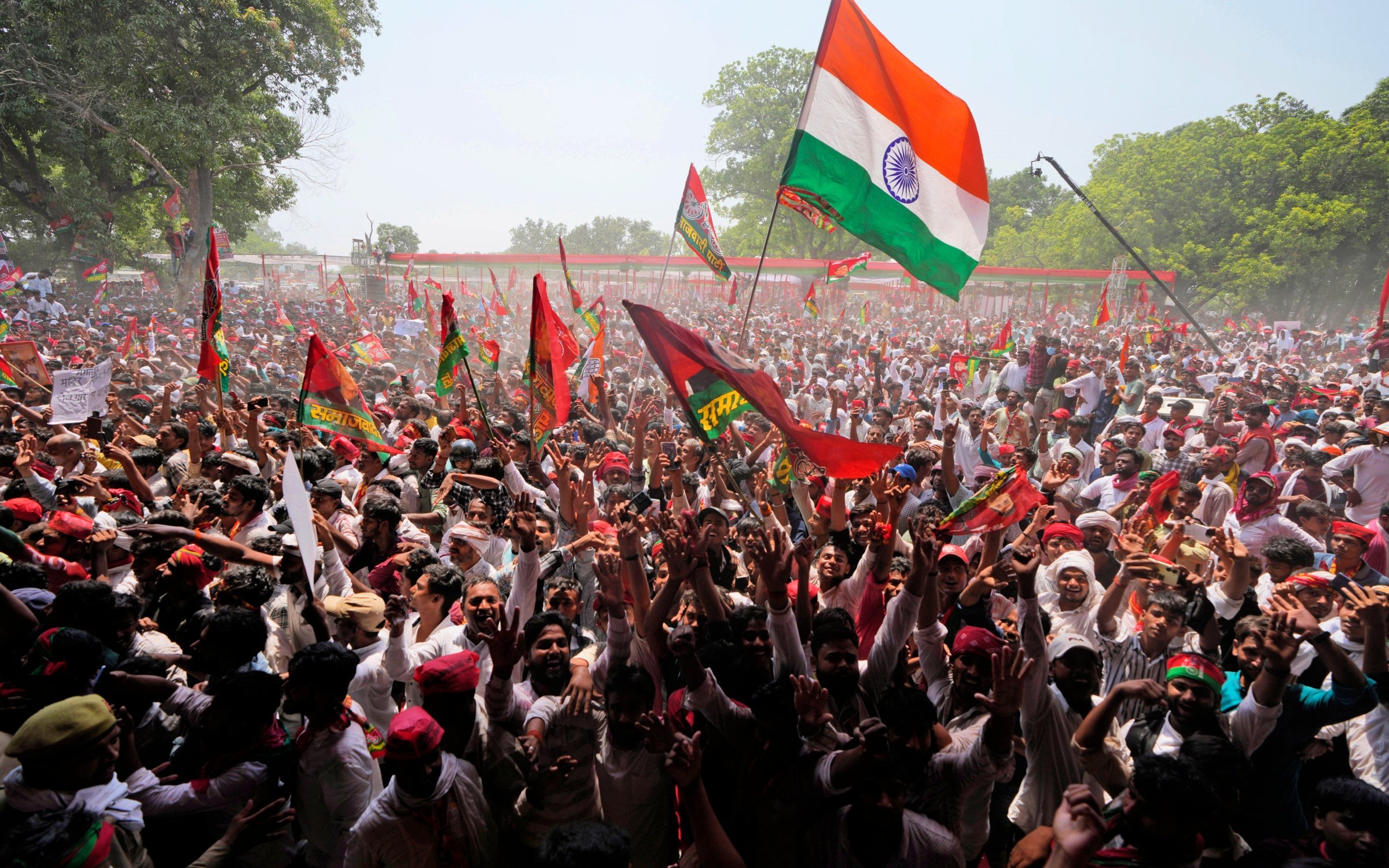 Supporters of the Samajwadi Party and Indian National Congress shout slogans and wave flags at an election rally, May 2024. Credit: Associated Press / Alamy Stock Photo