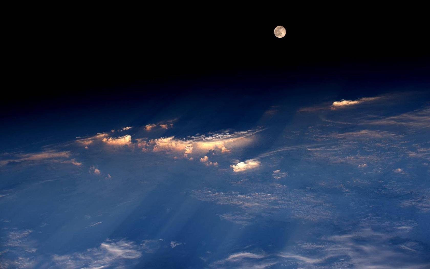 The Moon rising over Western China.