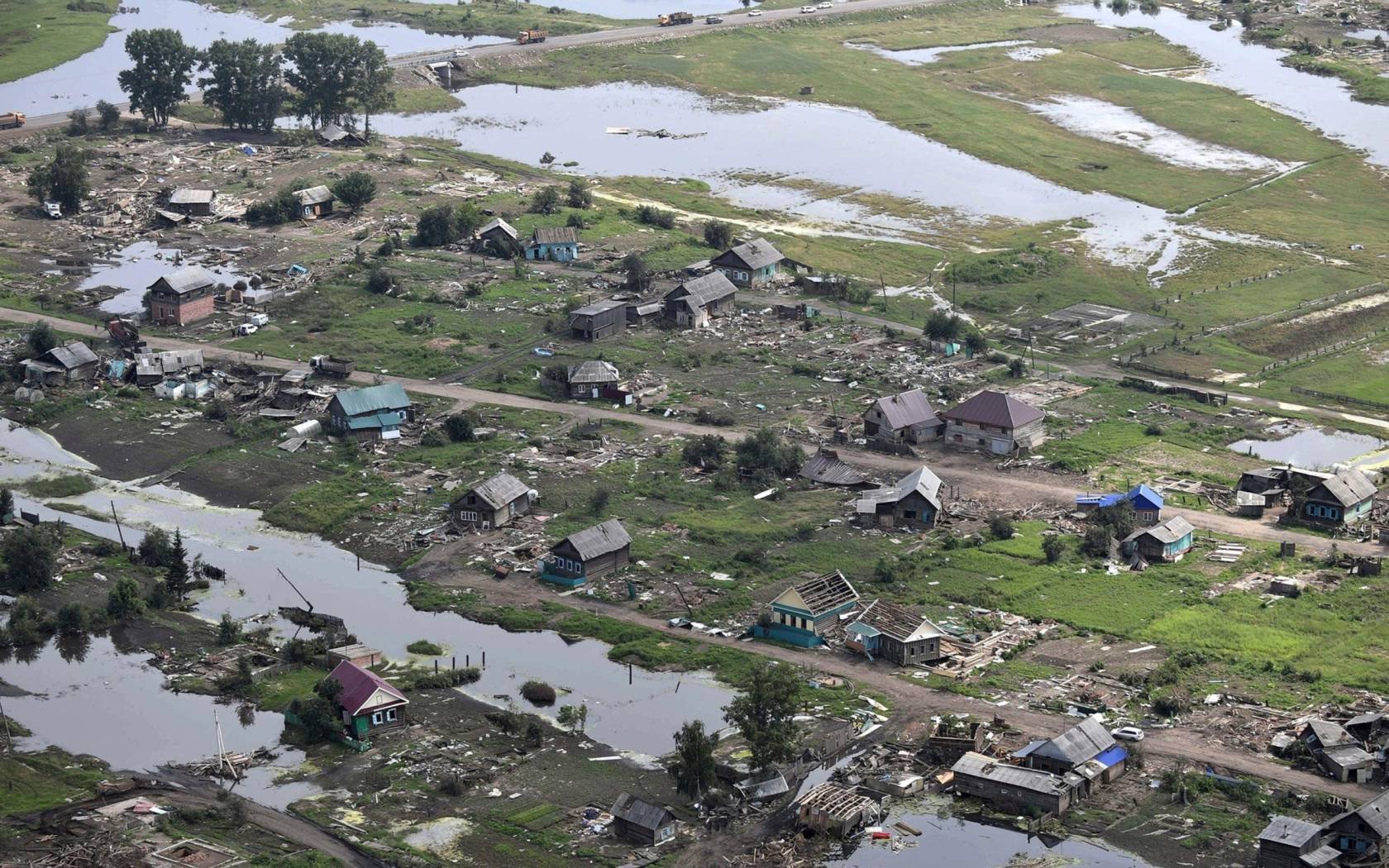 Aerial view of severe damage to homes caused by massive floods in the Irkutsk region of Russia, 2019.