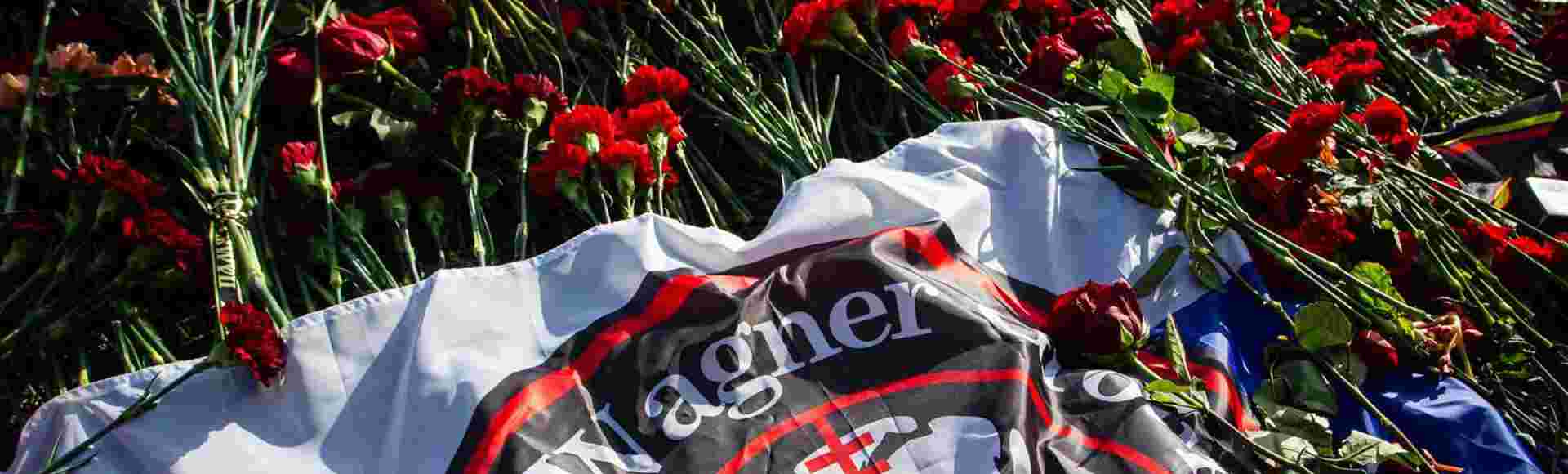 Flowers laid in memory of Yevgeny Prigozhin at a spontaneous memorial near the PMC Wagner headquarters in St. Petersburg.