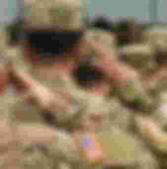 US troops salute. Credit: Bumble Dee / Alamy Stock Photo.