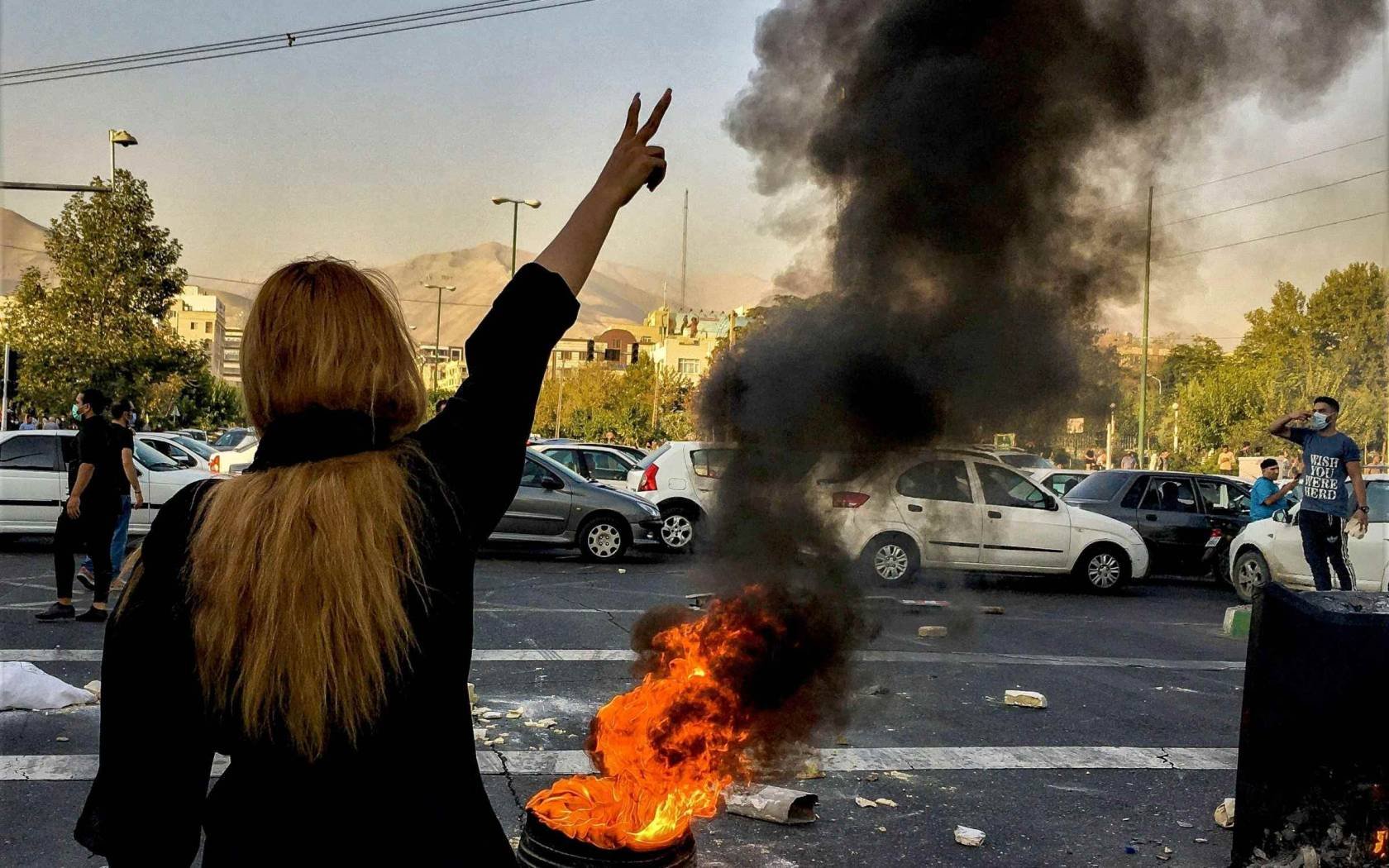 Iranians protesting against the death of 22-year-old Mahsa Amini after she was detained by the morality police, in Tehran, 1 October, 2022.