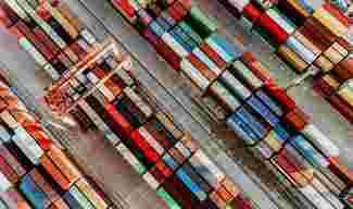 Aerial view of shipping container port terminal.