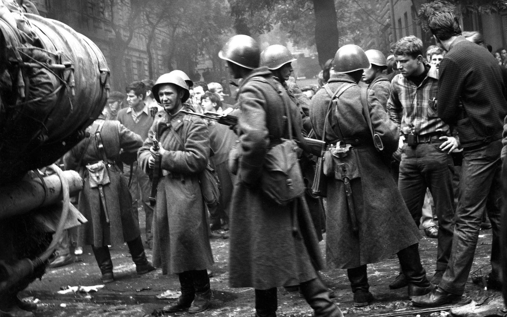 Soviet troops stand face to face with student youth protesters in Prague