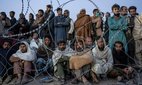 Afghan refugees wait to register in a camp near the Pakistan-Afghanistan border.