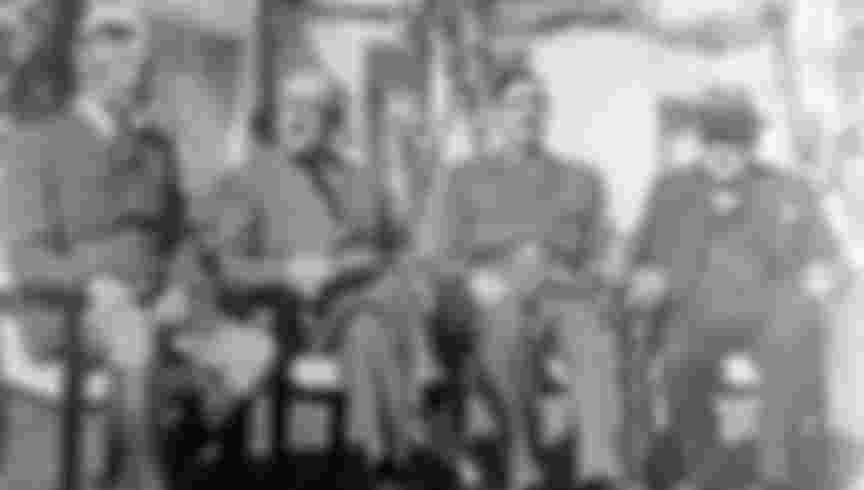 French leaders Henri Giraud (left) and Charles de Gaulle sit down after shaking hands in presence of Franklin D. Roosevelt and Winston Churchill at the Casablanca conference. Credit: GL Archive / Alamy Stock Photo.