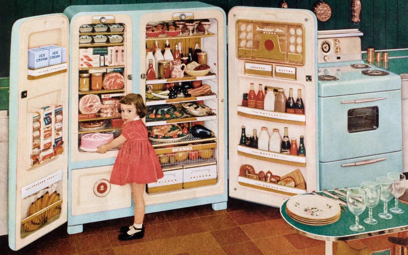 Advertisement of a huge open refrigerator stuffed with food, with a little girl reaching for a pink cake, 1955. Screen print from a photograph.