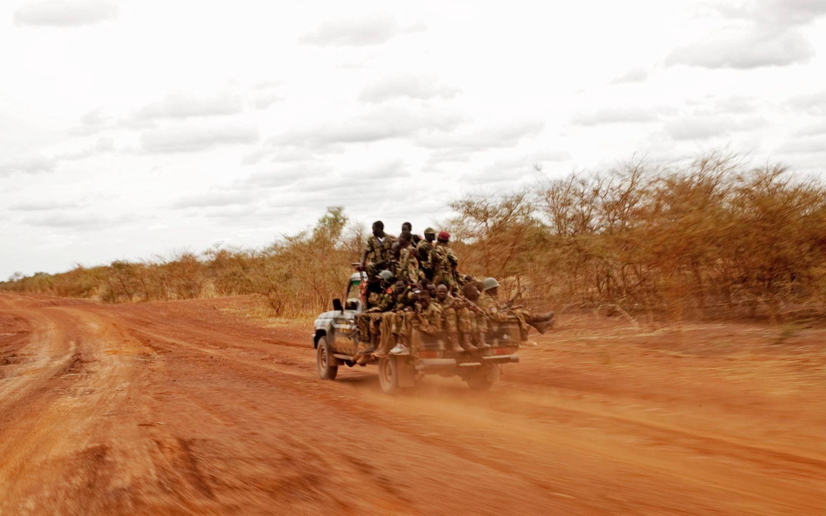 Sudan People's Liberation Army soldiers drive toward frontline positions near Pana Kuach in South Sudan on Friday May 11, 2012.