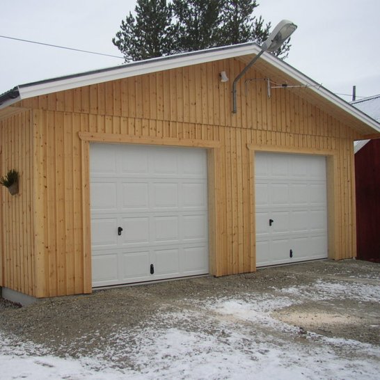 Natural wood aesthetic with double garage port