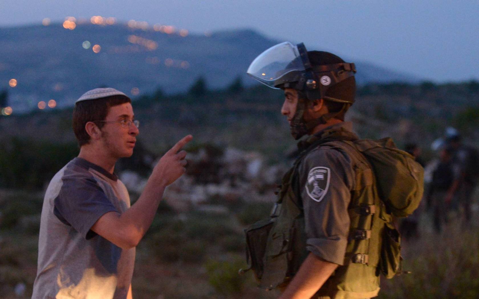 Jewish settlers protest at Tapuach, a major junction in the northern West Bank, 30 April 2013.