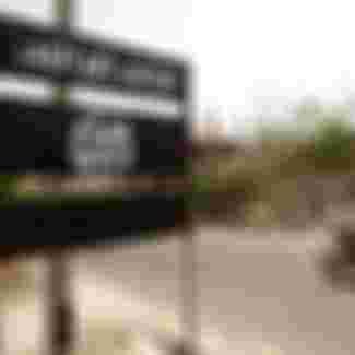 An al-Qaeda logo is seen on a street sign in the town of Jaar in southern Abyan province, Yemen.