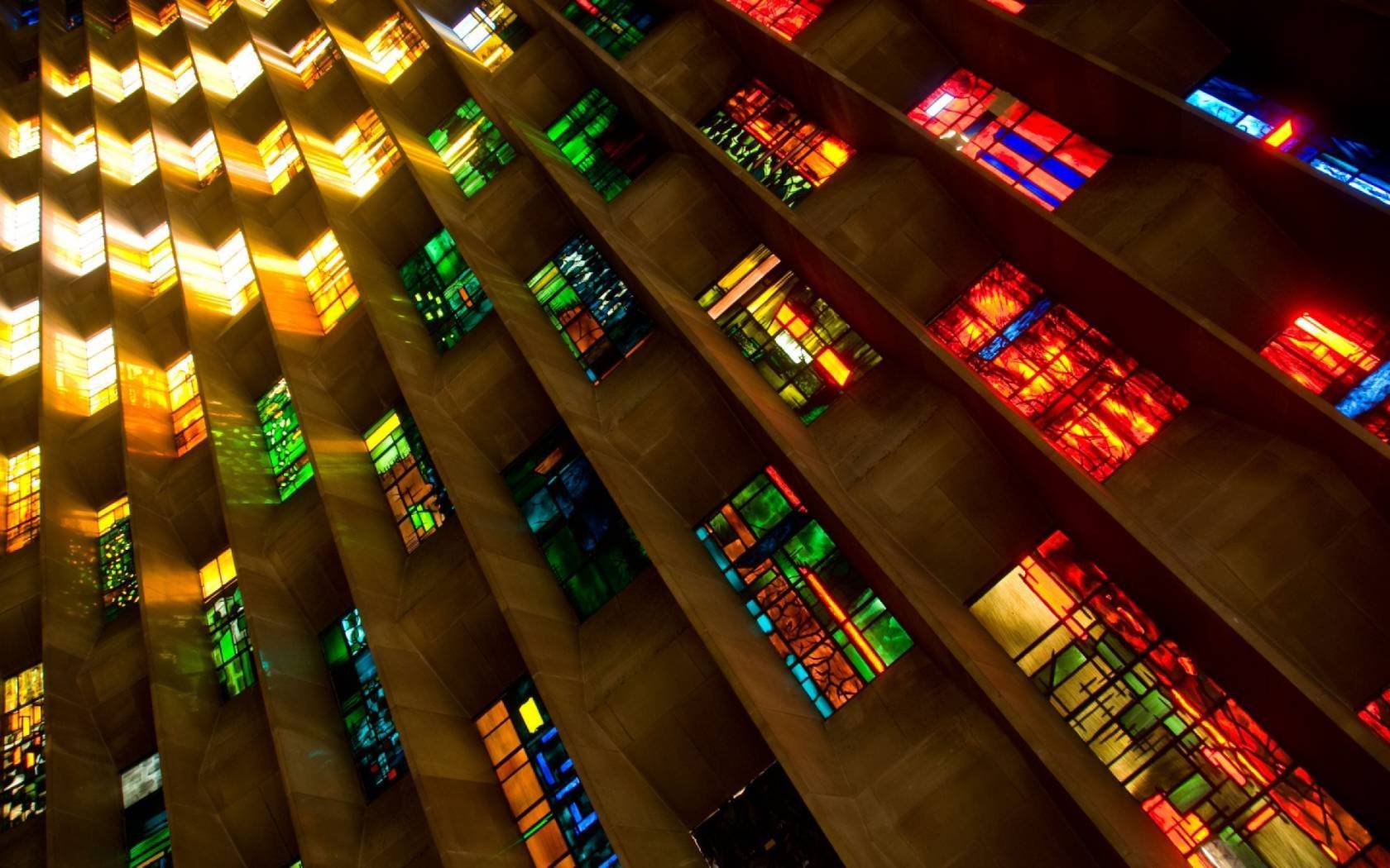 Stained glass windows inside Coventry Cathedral designed by the artist John Piper.