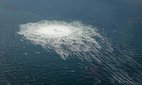 Gas from the ruptured Nord Stream 2 pipeline bubbles to the surface of the Baltic, seen from a Danish F-16 on 27 September 2022.