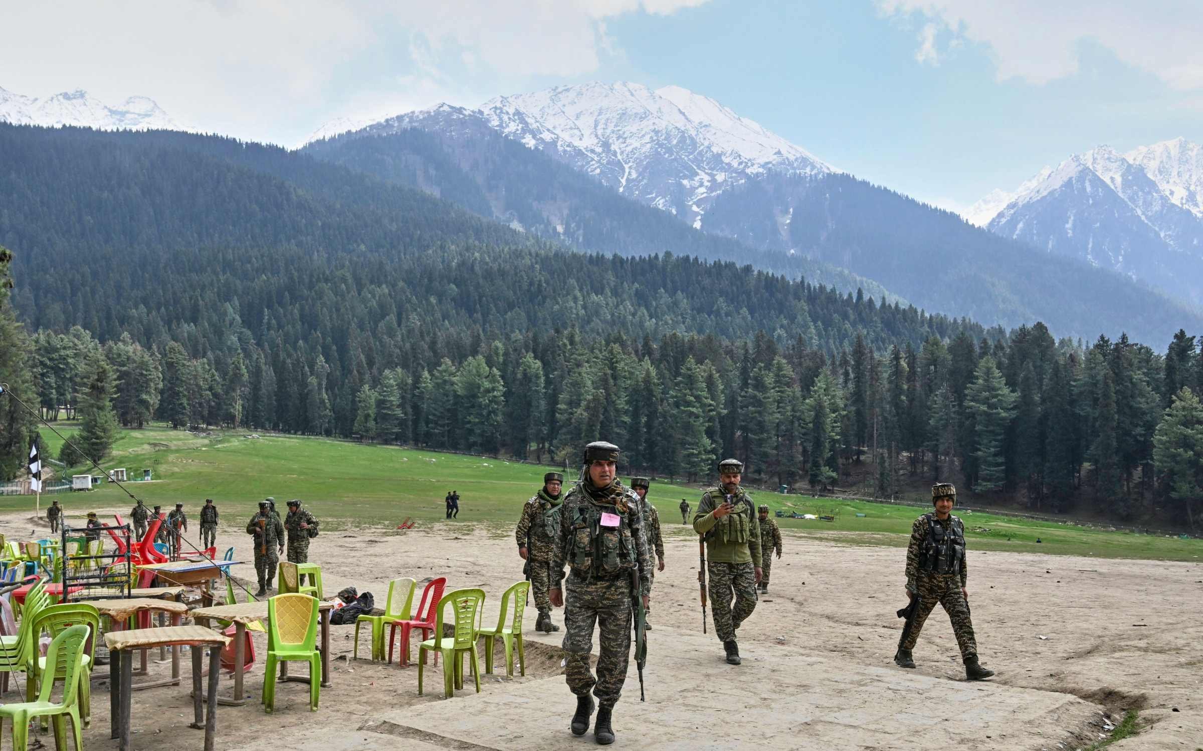 Indian security personnel inspect the site of a militant attack on tourists at Pahalgam in Indian-controlled Kashmir.