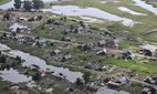 Aerial view of severe damage to homes caused by massive floods in the Irkutsk region of Russia, 2019.