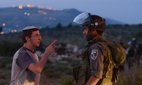 Jewish settlers protest at Tapuach, a major junction in the northern West Bank, 30 April 2013.