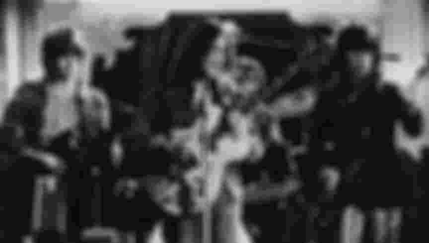 Eric Clapton, John Lennon (1940 - 1980) and Keith Richards performing together at the Rolling Stones Rock And Roll Circus, Internel Studios in Stonebridge Park, Wembley, December 1968.