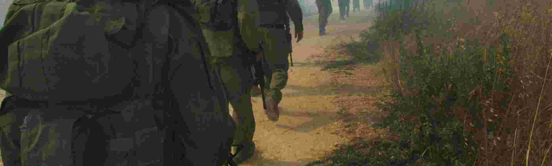 Israeli soldiers advance towards southern Lebanon near the northern Israeli village of Avivim in 2006.