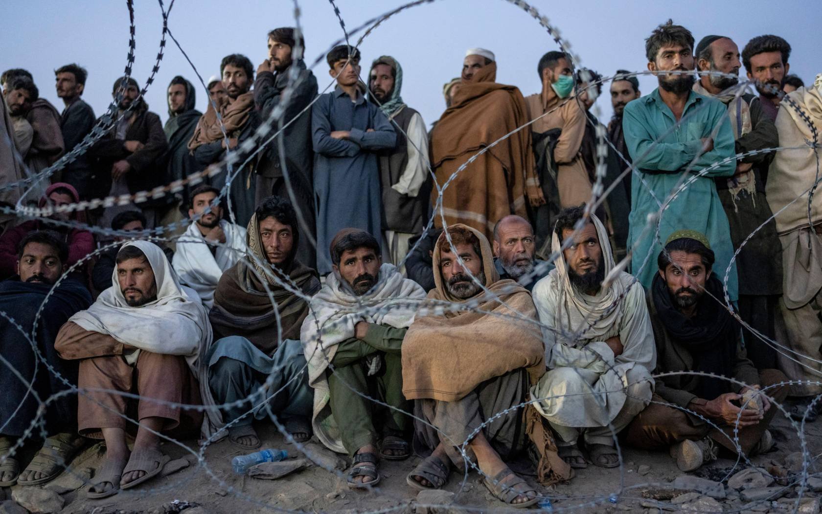 Afghan refugees wait to register in a camp near the Pakistan-Afghanistan border.