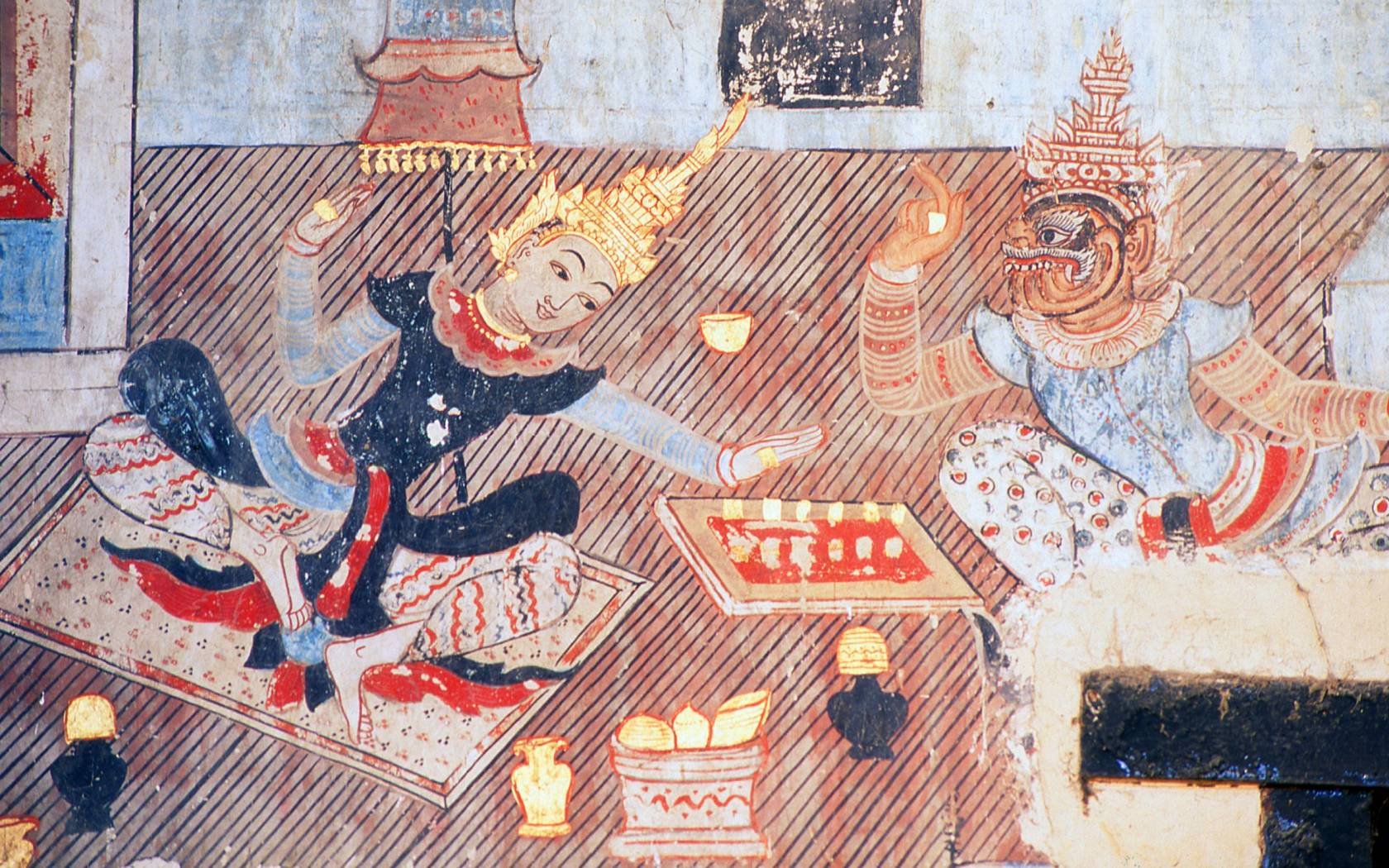 Prince Siddhartha and a demon play chess in a mural at Wat Buak Krok Luang, Northern thailand.