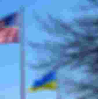 The flags of the United States and Ukraine flying side by side.