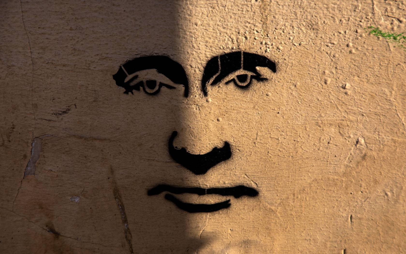 Graffiti of Vladimir Putin on building wall on Maroseyka street in the central Moscow, Russia.
