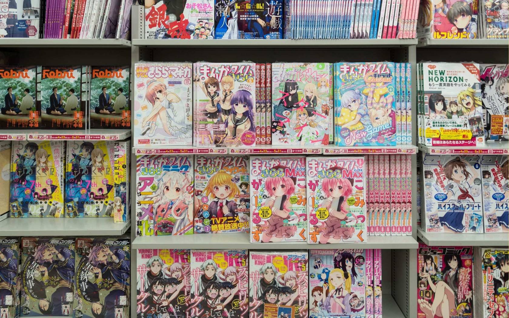 Bookshelf with anime comic books and magazine in a shop in Akihibara, Tokyo, Japan.