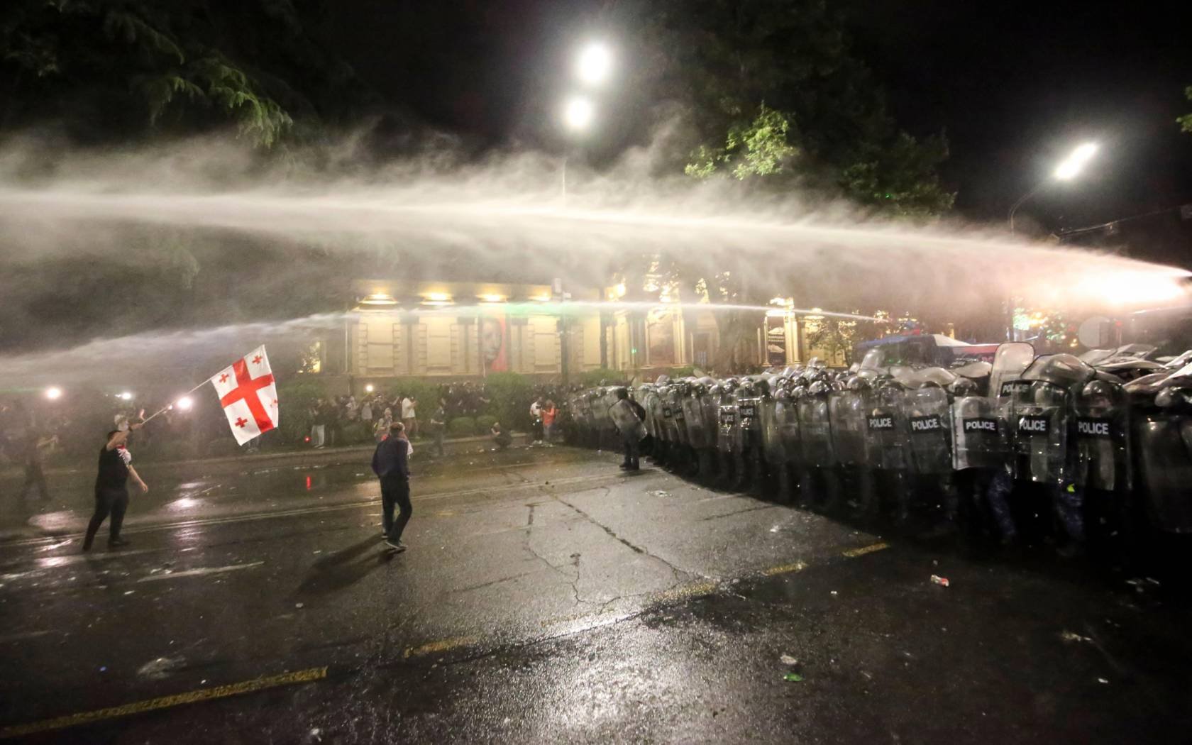 Riot police use a water cannon during an opposition protest against 'the Russian law' near the Parliament building in Tbilisi, Georgia, on May 1, 2024.