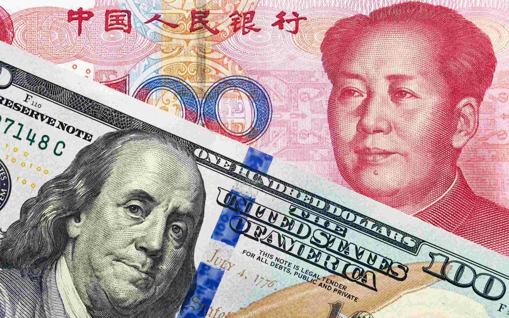US dollar and Renminbi banknotes.