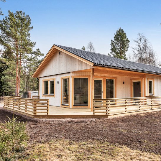 Natural color finish with surrounding wood porch