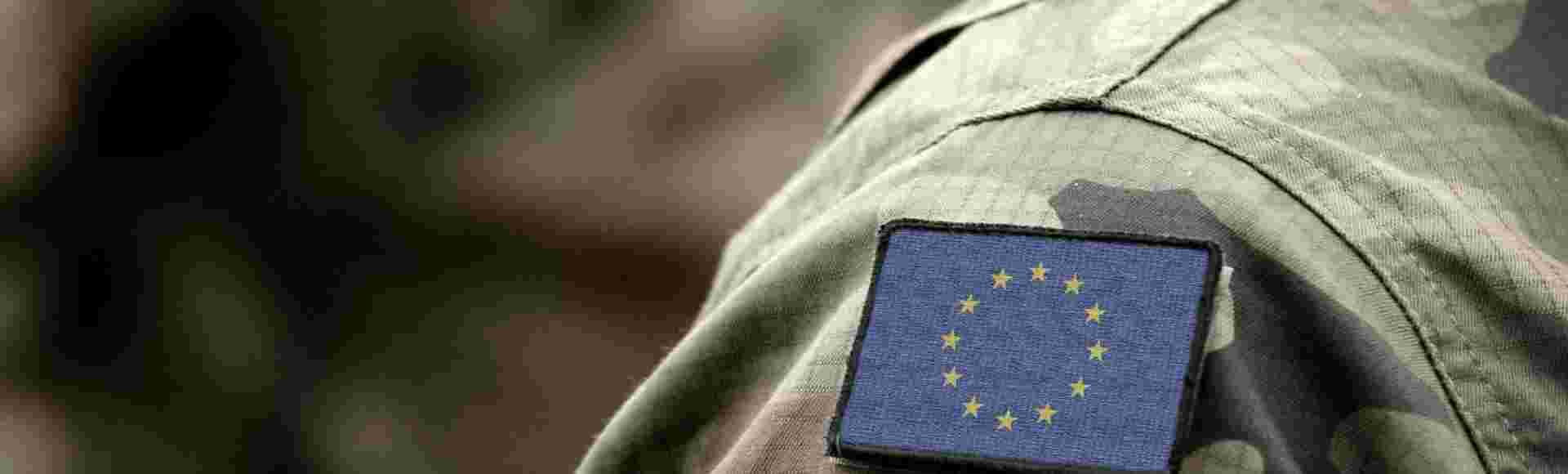 The EU flag on a military uniform.