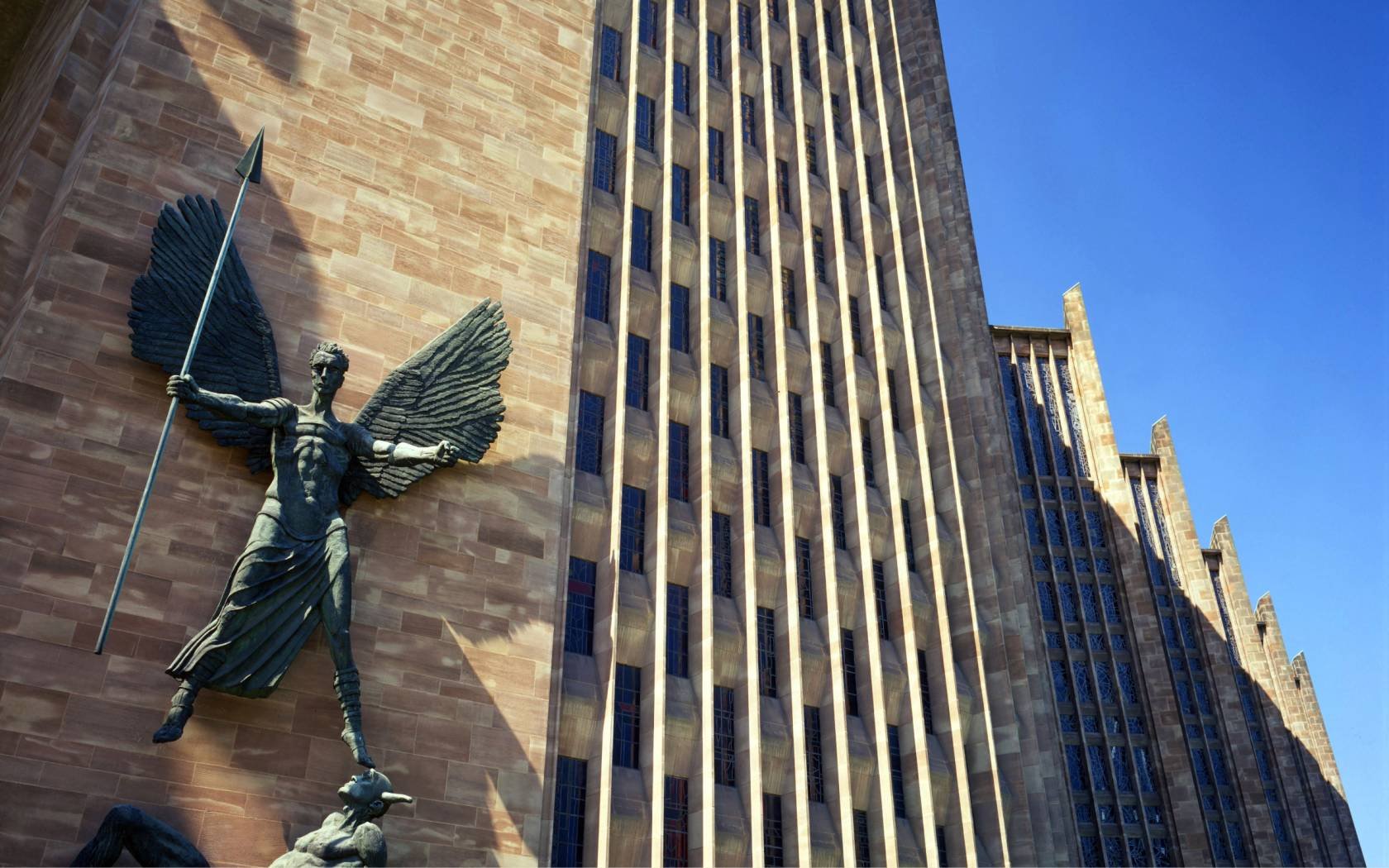 Jacob Epstein's statue of St Michael subduing the Devil at Coventry Cathedral.