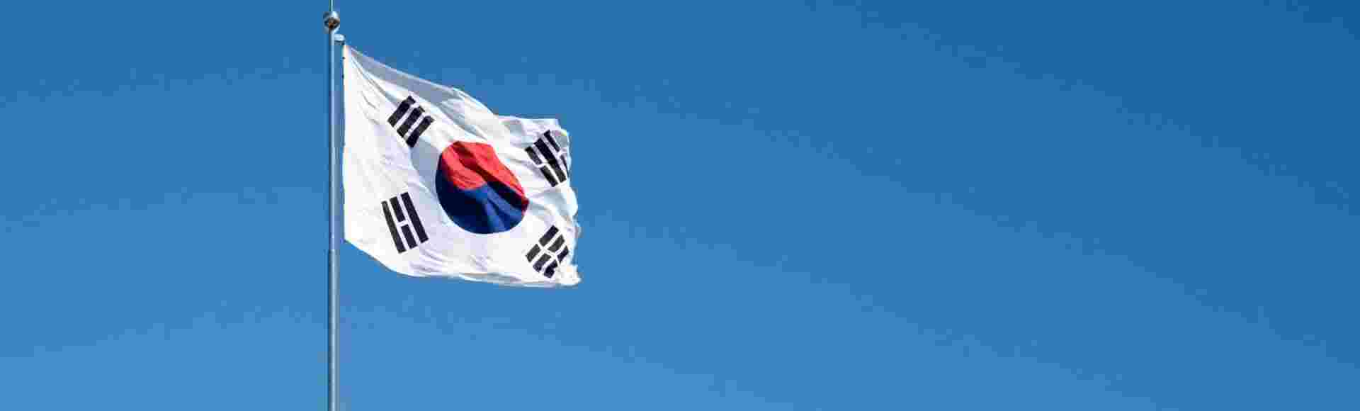 Flag of South Korea against a blue sky.