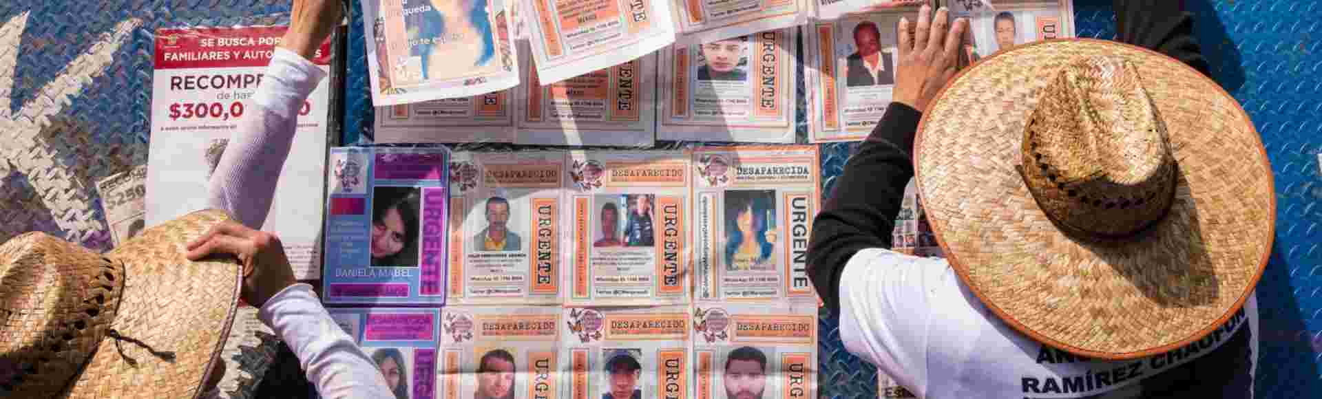 Relatives put up images of missing persons in Mexico City. Credit: Frank Nowikowski