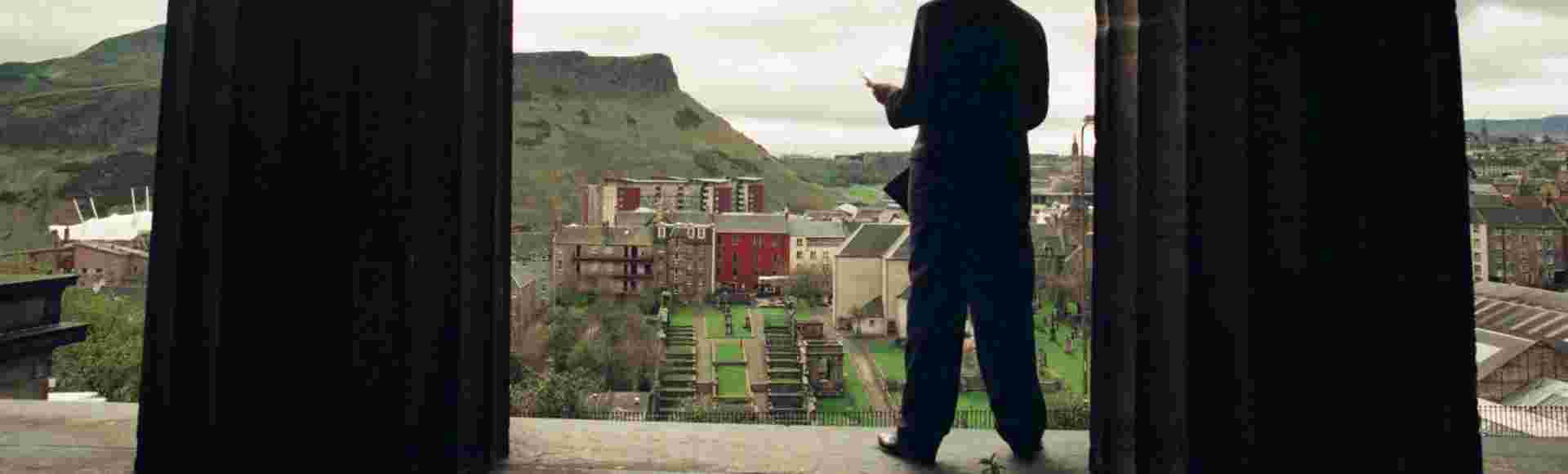 Alex Salmond poses for photographs with a copy of the SNP's 1999 election manifesto at the former Royal High School building in Edinburgh, Scotland.